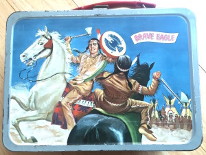 Boys' lunch boxes tended have masculine, violent themes: Cowboys & Indians, war, TV Western gunfighters, frontier heroes like Daniel Boone and Davy Crockett, outer space, etc. None of these lunch boxes are politically correct today! 