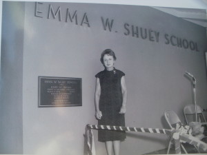 Principal Emma W. Shuey stands by the new plaque honoring her. 